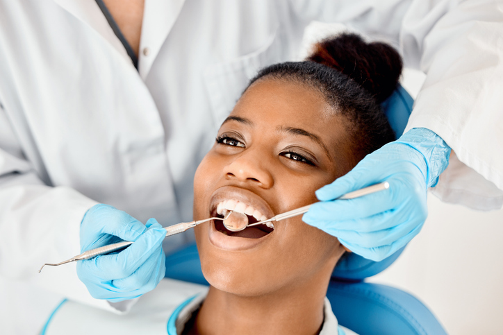 female patient getting dental cleaning in Boston