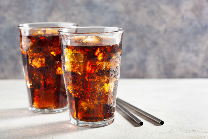 Two glasses of soda with metal straws